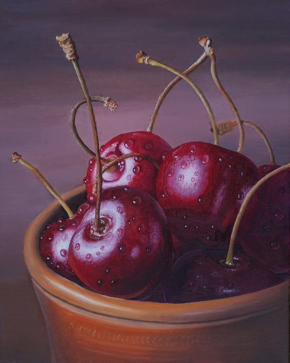 Cherries in a clay mug