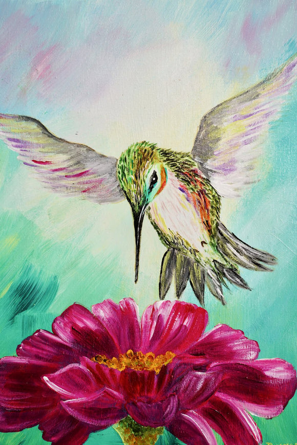 Hummingbird and pink bloom
