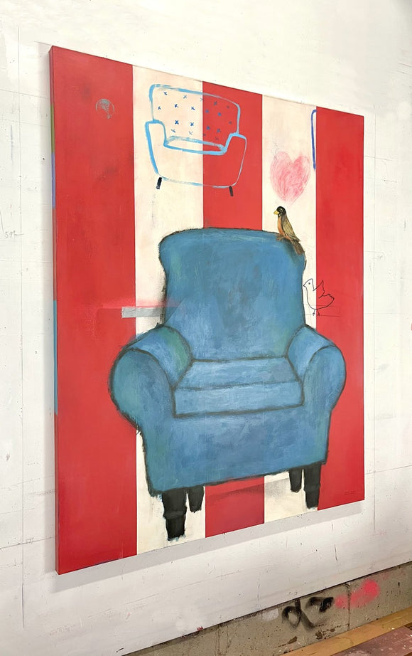 A Blue Couch and A Bird