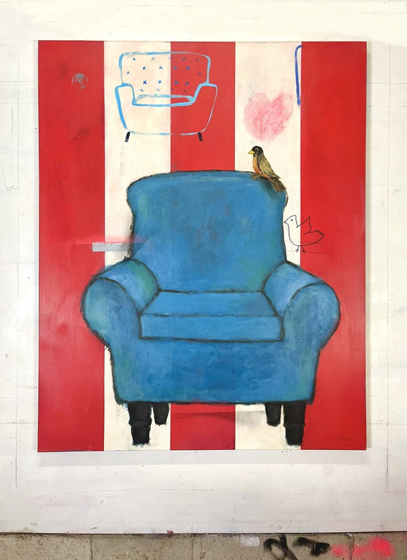 A Blue Couch and A Bird