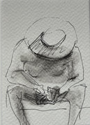 A man in a hat on the beach is busy with the phone-1
