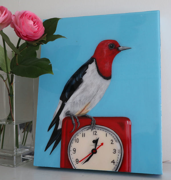 Red Headed Woodpecker on Vintage Clock