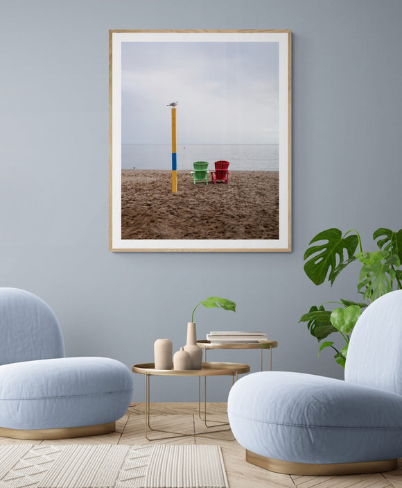 Seagull and two beach chairs