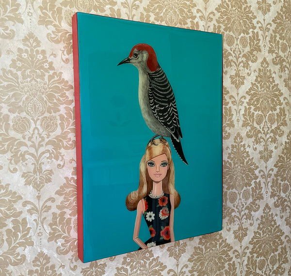 Red Belliedwoodpecker on Barbie Doll