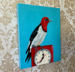 Red Headed Woodpecker on Vintage Clock